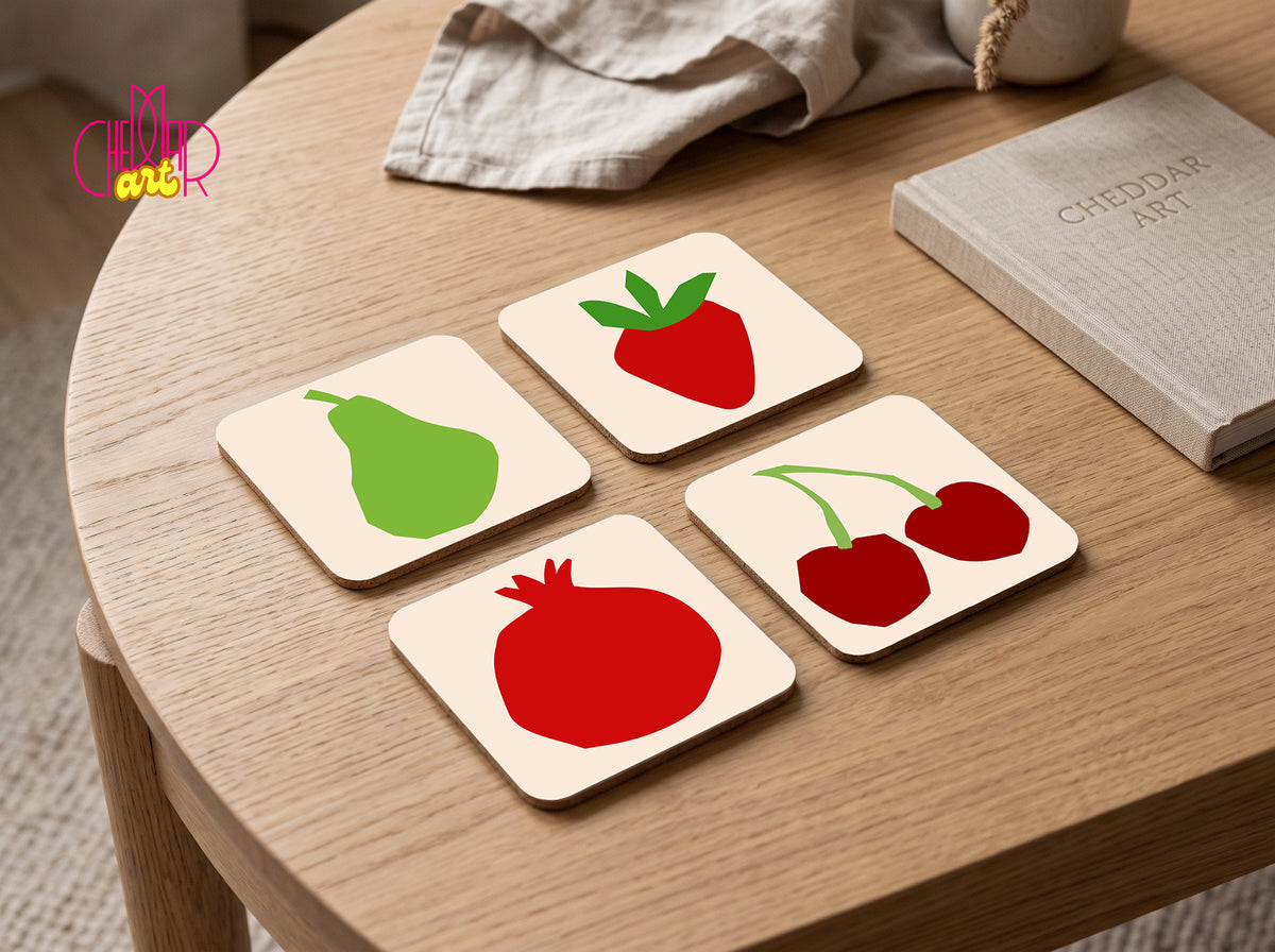Set of 4 square cork coasters with colorful Henri Matisse style fruit paper cut-out designs on a soft cream background